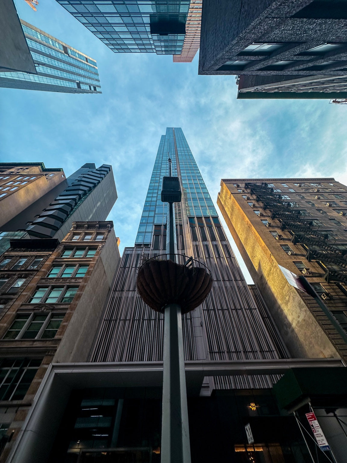 Looking up between New York skyscrapers