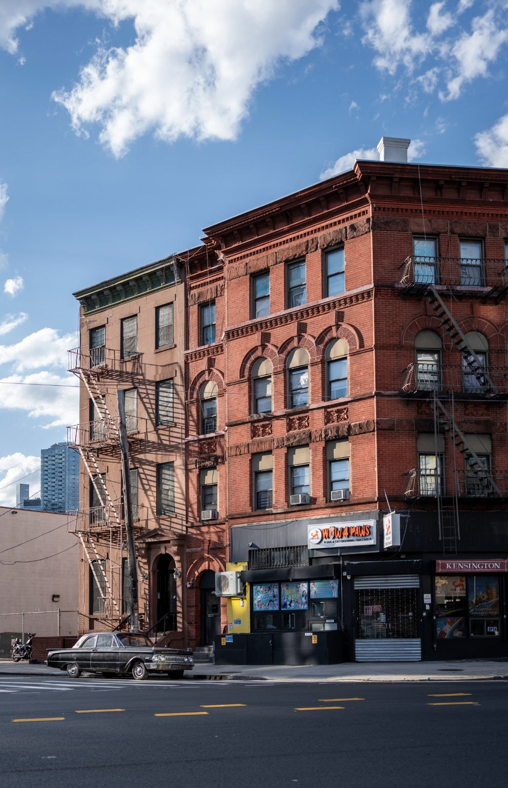 Red brick buildings and a vintage car on a New York street