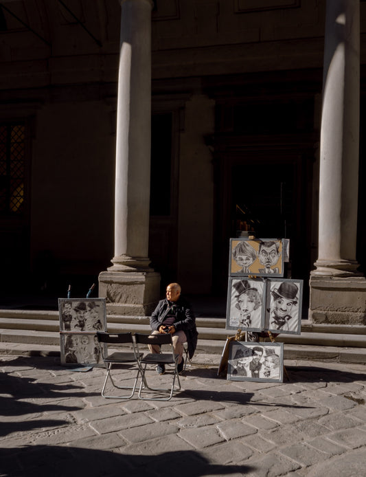 A street artist in the light of Florence