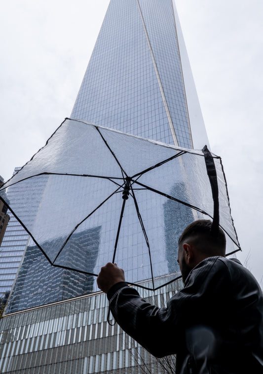 A passerby with a clear umbrella