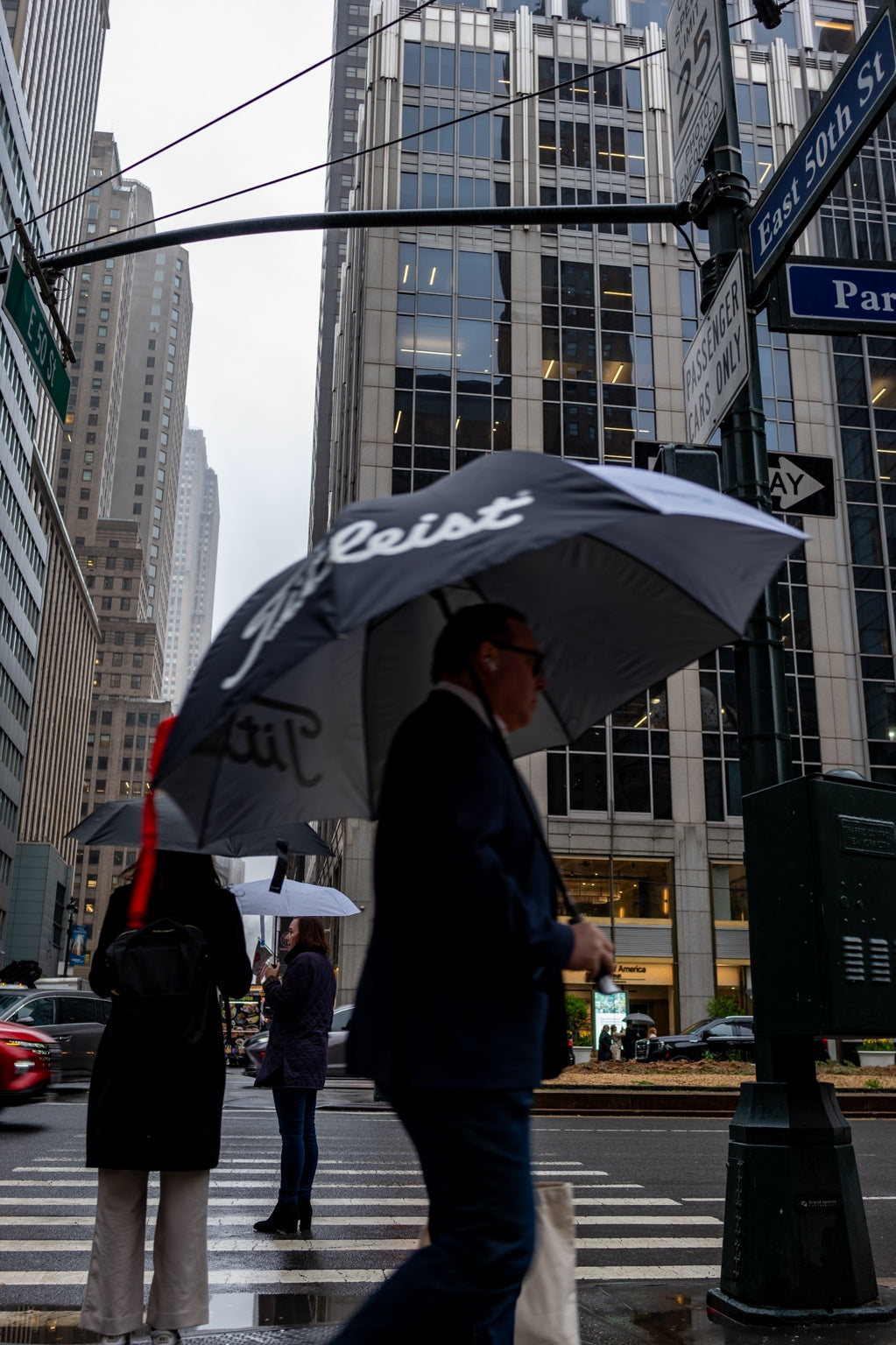 A man with an umbrella on a New York street