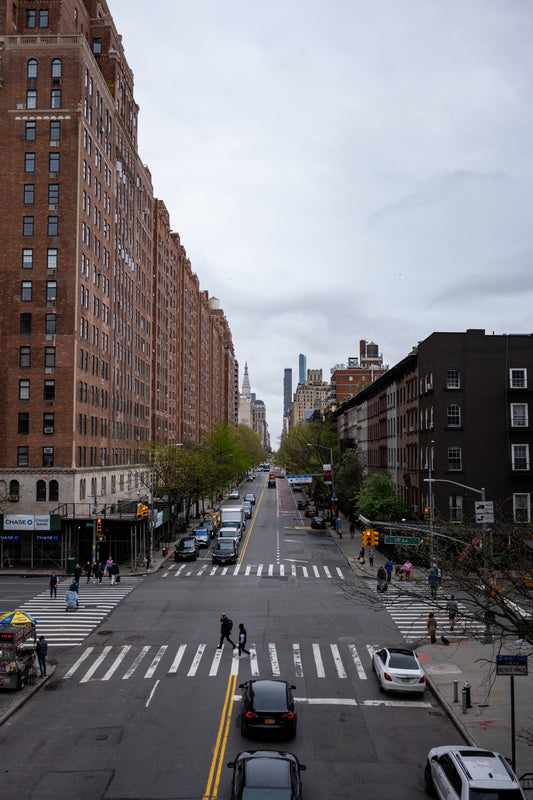 A New York street beneath a cloudy sky