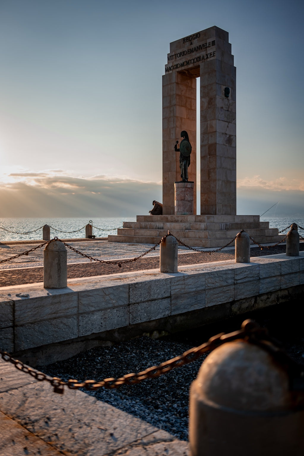 Monument beside the sea at Reggio Calabria in evening light
