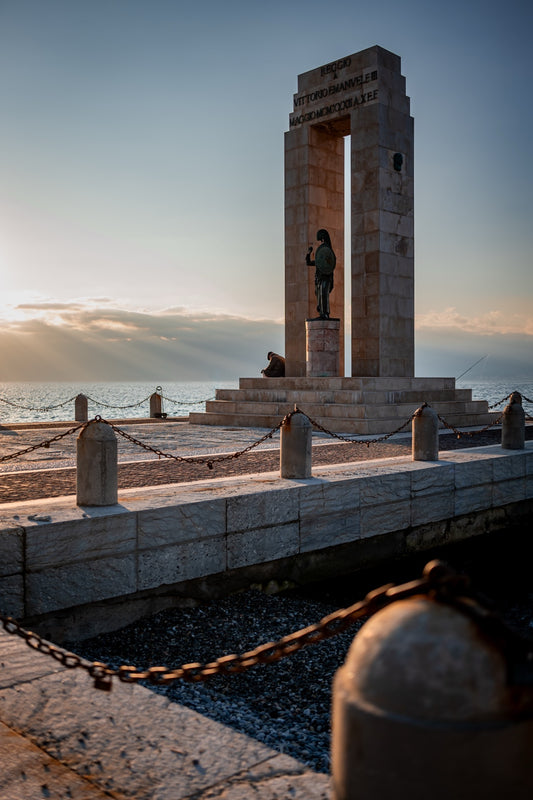 Monument beside the sea at Reggio Calabria in evening light