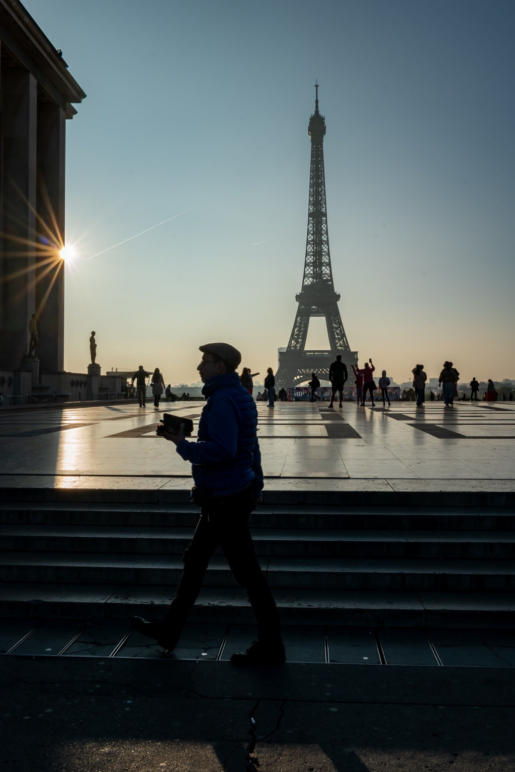 A passerby near the Eiffel Tower